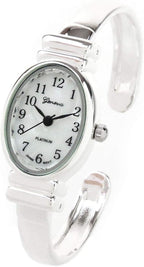 Reloj de pulsera de plata de tamaño pequeño con banda de metal ovalado para mujer de Ginebra