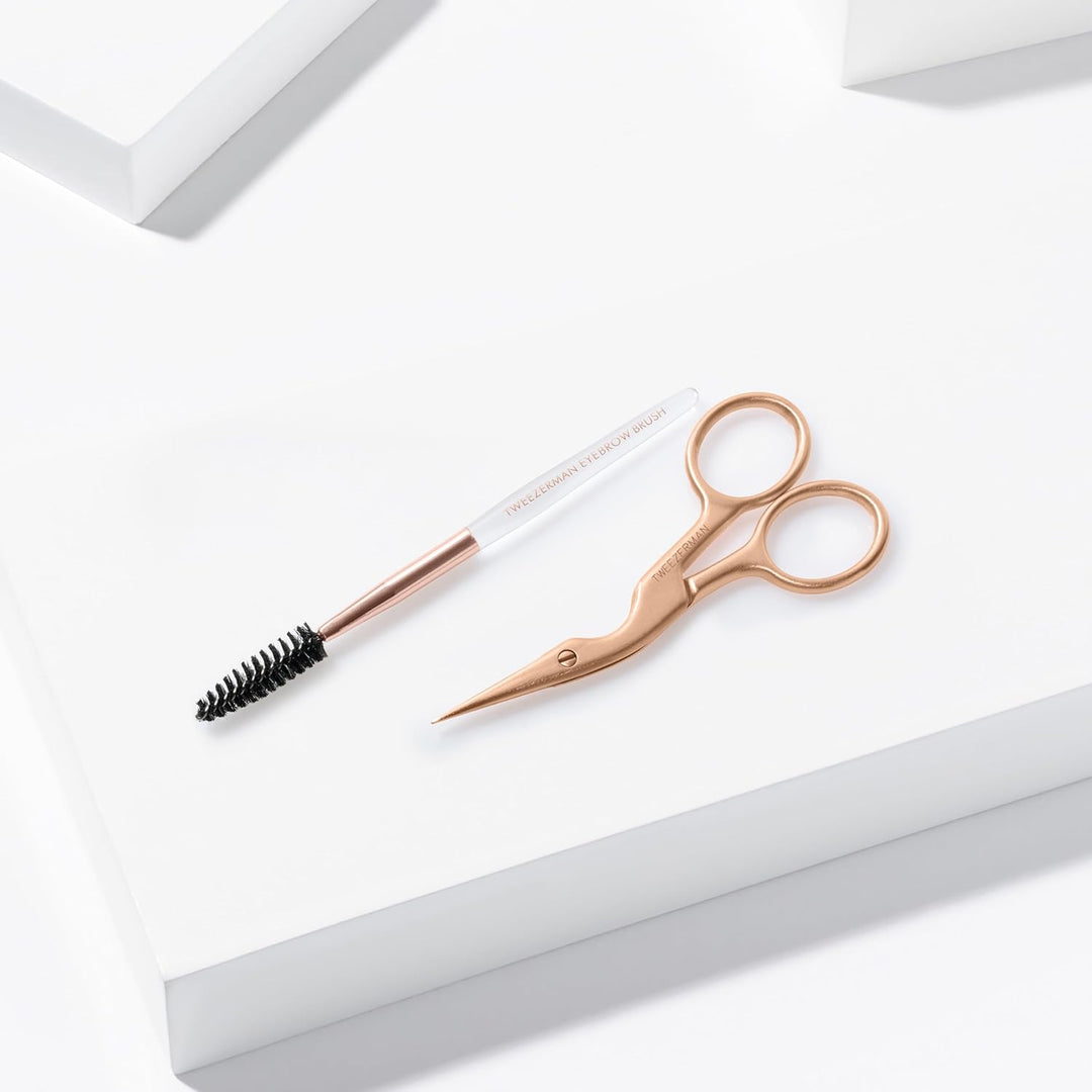 Tweezerman Tijera de cejas y cepillo de cejas de oro rosa