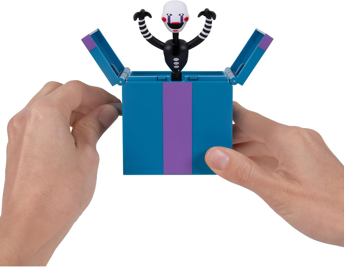 Jazwares Five Nights at Freddy's Puppet - Figura articulada de 5 pulgadas con función Jumpscare, ojos que brillan en la oscuridad y diorama óptico