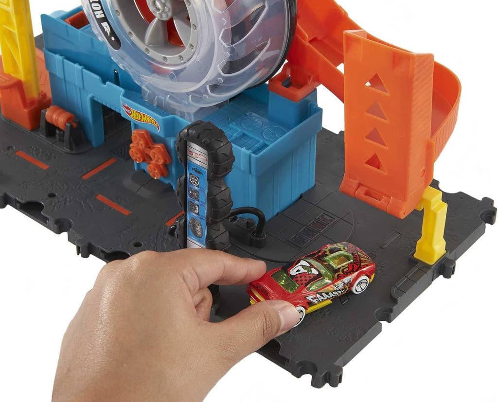 Hot Wheels City Super Twist Tire Shop Set de Juego y Auto de Juguete