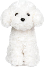 Cachorro de perro de peluche caniche blanco