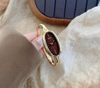 Reloj de pulsera minimalista con brazalete ovalado delicado para mujer