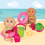 Parche de repollo para niños en la playa, pequeño, con flotador de juguete rosa, cubo y pala y sandía – muñecas CPK de 9 pulgadas – crece tu parche de repollo – juega dentro o fuera del agua, multi