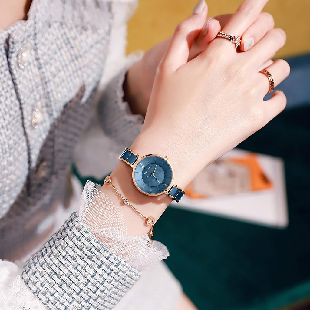 ROCOSJEWE Reloj analógico de cuarzo de cerámica para mujer, esfera azul con acento de oro rosa, diseño ultrafino, cierre de mariposa, relojes impermeables de 98.4 ft para mujer