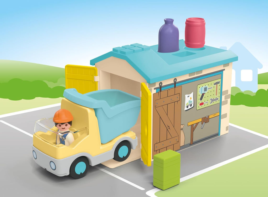 Playmobil Junior: Camión de construcción con garaje