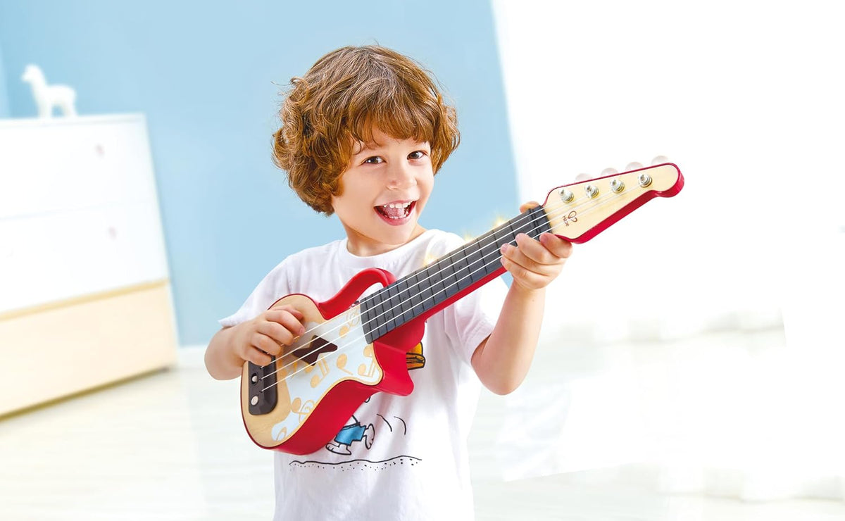 Hape Aprende con luces Ukelele electrónico rojo | Modo de inclinación y banda | Instrumento musical