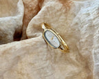 Reloj de pulsera minimalista con brazalete ovalado delicado para mujer