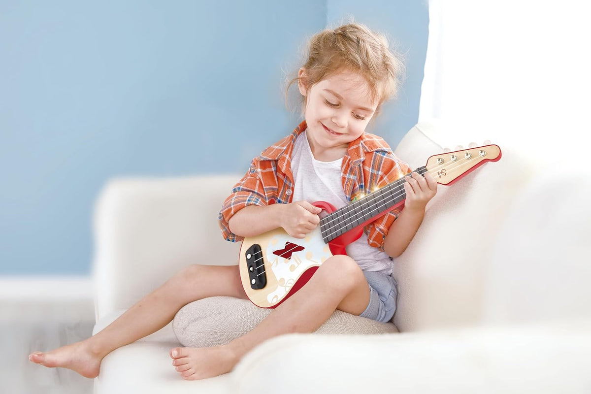 Hape Aprende con luces Ukelele electrónico rojo | Modo de inclinación y banda | Instrumento musical