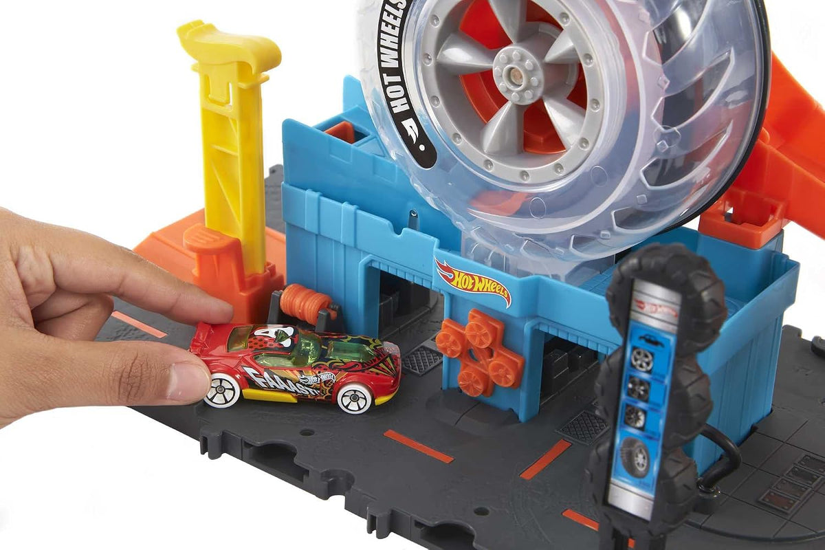Hot Wheels City Super Twist Tire Shop Set de Juego y Auto de Juguete
