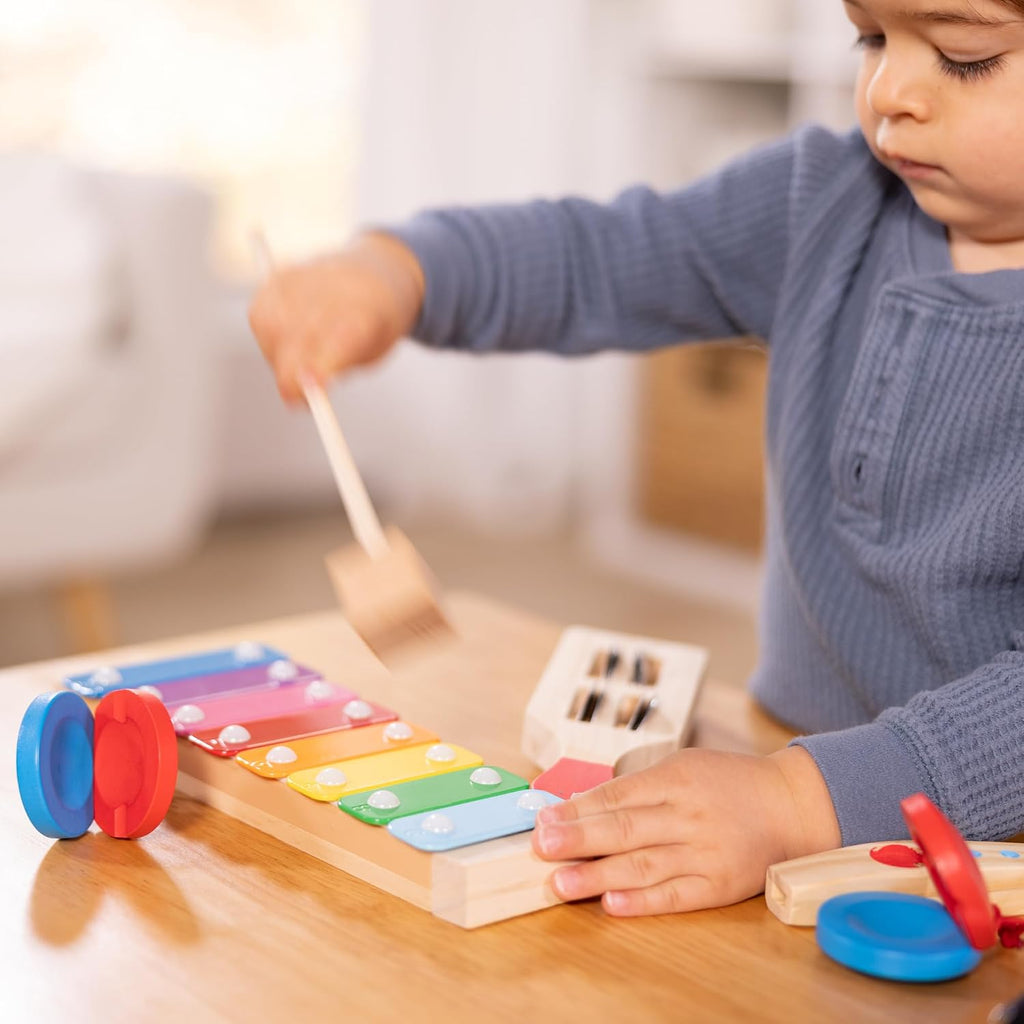 Melissa & Doug Band-in-a-Box - Juego de instrumentos de madera de 7 piezas