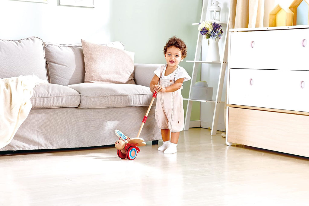 Hape - Juguete galardonado de mariposa de madera para empujar y tirar para niños, Medidas: L: 16 cm, An: 14.7 cm, Al: 56.4 cm, Color: Rojo