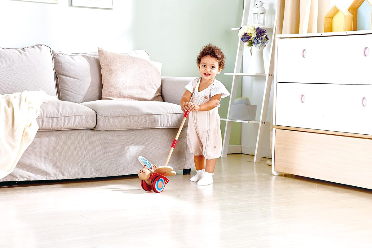 Hape - Juguete galardonado de mariposa de madera para empujar y tirar para niños, Medidas: L: 16 cm, An: 14.7 cm, Al: 56.4 cm, Color: Rojo