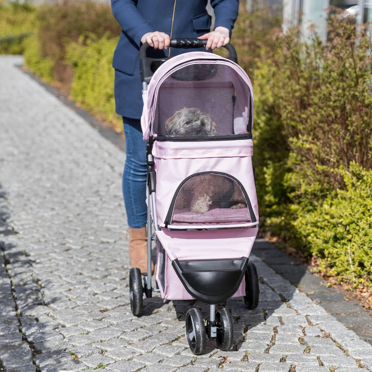 Trixie Cochecito plegable para mascotas para gatos y perros, carrito transportador de mascotas con cubierta climática, cesta de almacenamiento, soporte para tazas, rosa