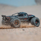 ARRMA Camión RC Outcast 4X4 8S BLX 1/5 Camión de Acrobacias Negro RTR (Transmisor y Receptor Incluidos, Batería y Cargador No Incluidos) ARA5810V2T1