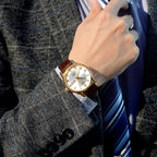 ROCOSJEWE Reloj de vestir masculino automático de cuerda automática - Caja de acero inoxidable dorado, números romanos, correa de cuero marrón, indicación de día y fecha, tapa esqueletada, reloj de pulsera de lujo para negocios, uso casual y diario