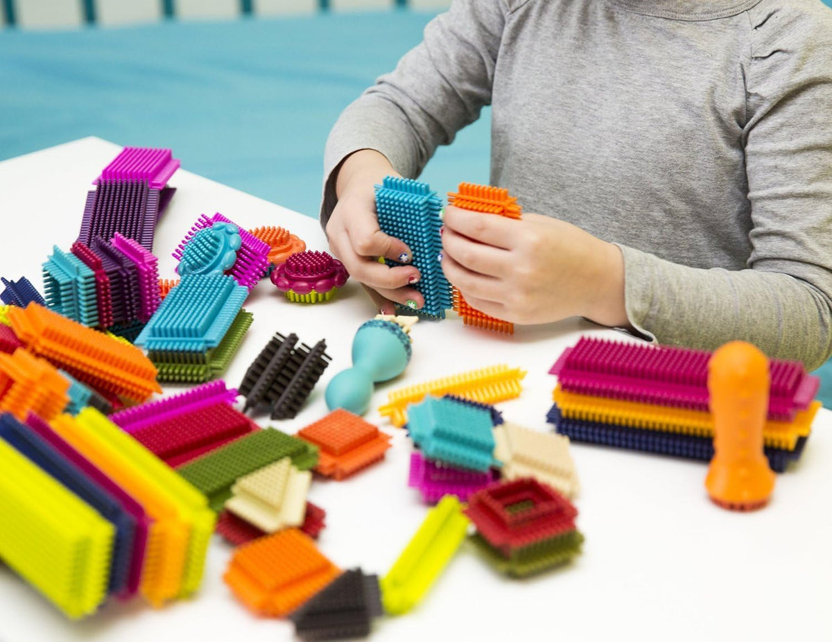 B. toys Bloques de cerdas, 68 bloques entrelazados en frasco, construcción