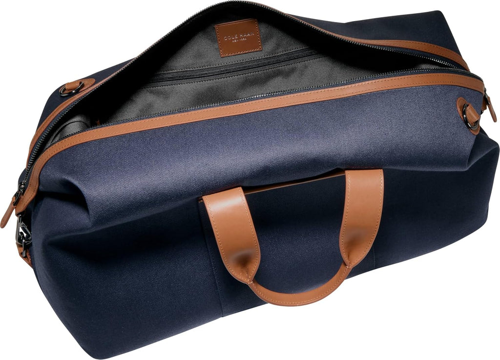 Cole Haan Judson - Bolsa de lona de sarga cepillada para hombre, Luna de medianoche/Nuevo bronceado británico, Judson - Bolsa de lona de sarga cepillada