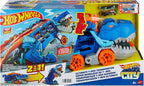 Hot Wheels City Ultimate Transportador T-Rex y 2 Autos de Moda a Escala