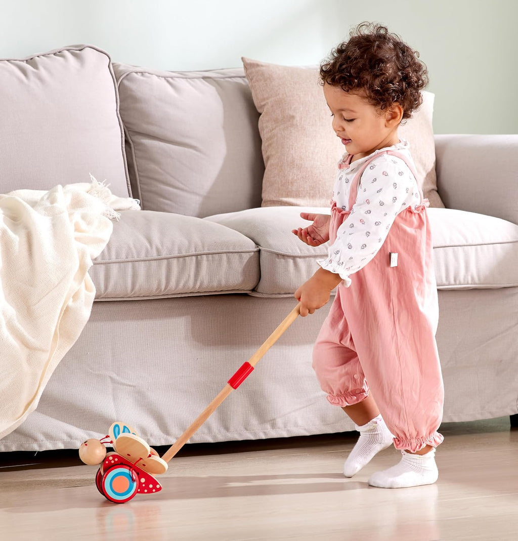 Hape - Juguete galardonado de mariposa de madera para empujar y tirar para niños, Medidas: L: 16 cm, An: 14.7 cm, Al: 56.4 cm, Color: Rojo