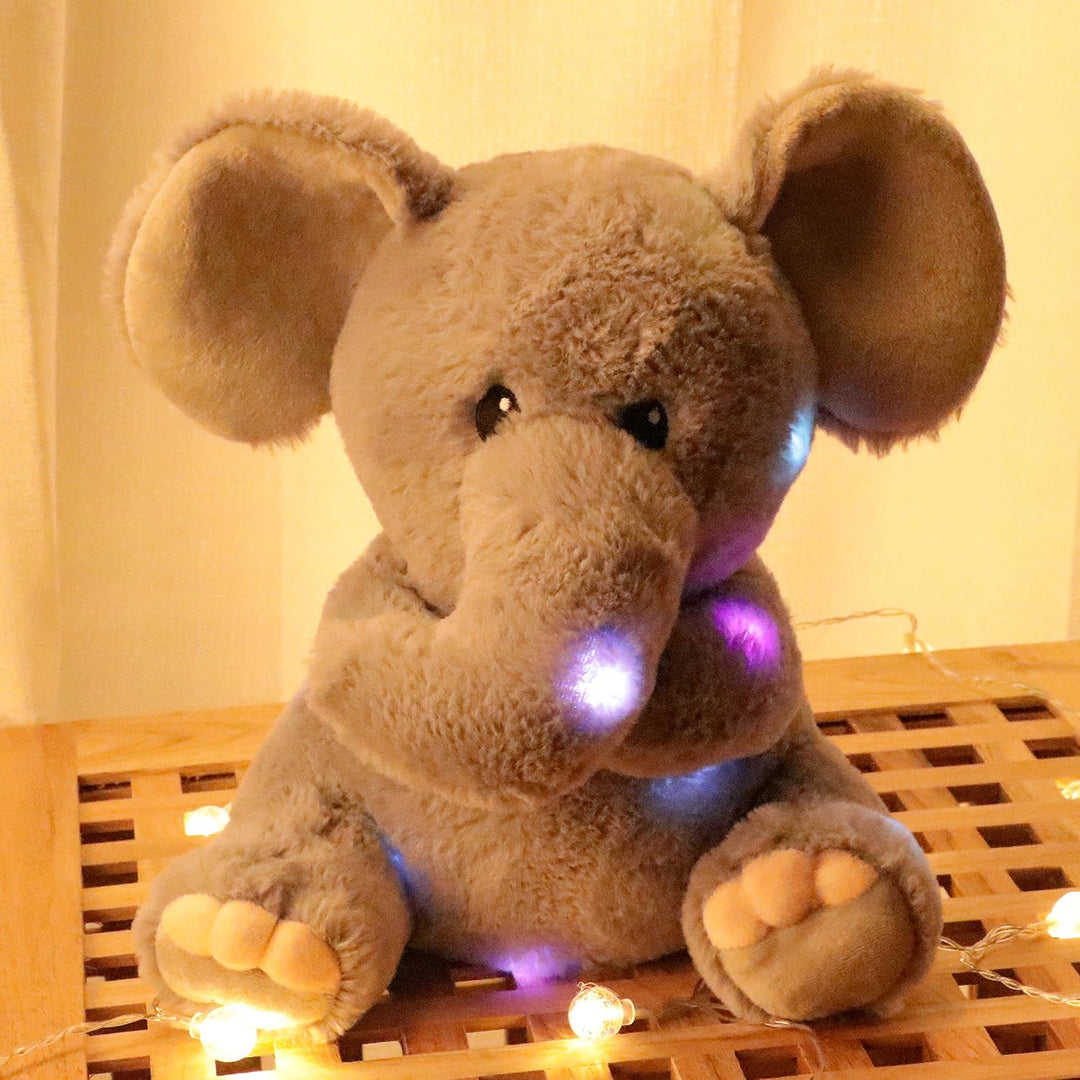 Hopearl Elefante de peluche musical LED que ilumina y canta, volume...